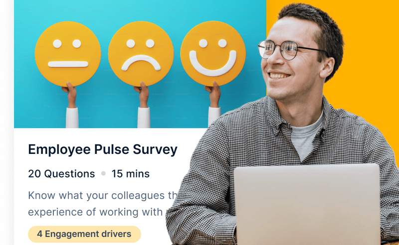 a man stands with a laptop and smiles. There is a background of employee pulse survey